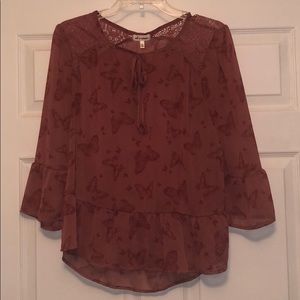 Loose red tinted blouse with butterfly print